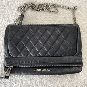 Jimmy Choo Bex black fold over quilted crossbody bag with metal strap.